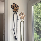 Personalised wooden paw print leash holder engraved with a pet's name