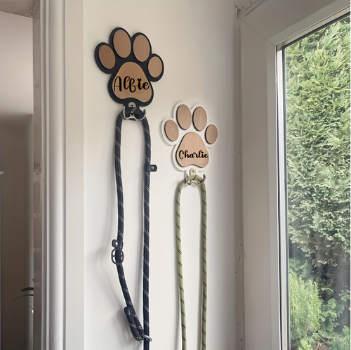 Personalised wooden paw print leash holder engraved with a pet's name